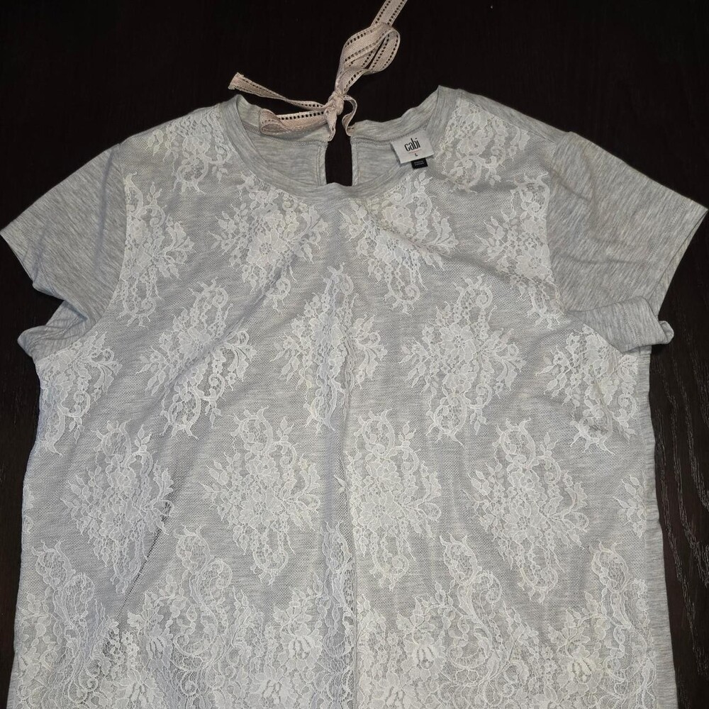 Cute white lace blouse with tie back detail, size L. Nylon, cotton & spandex ble